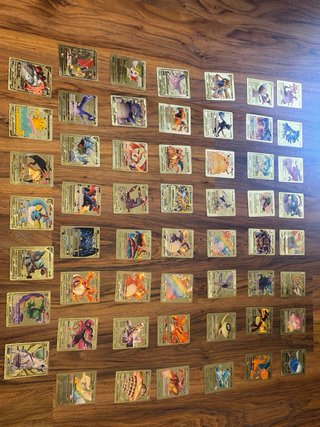 55 Cartas Pokémon Doradas + 2 Metálicas