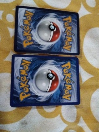 Cartas Pokémon Tyranitar y Houndoom