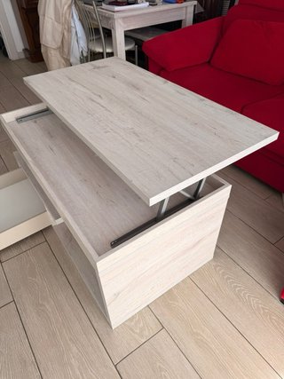 Mesa comedor extenexten y centro elevable y cajón.