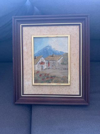 Cuadro de casas y montañas
