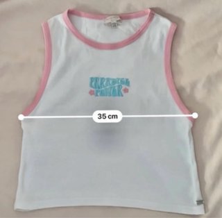 Camiseta sin mangas blanca con ribete rosa