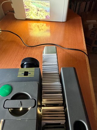 Proyector Reflecta Diamator AF con cargadores.