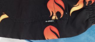 Costume uomo fiamme nere e arancioni