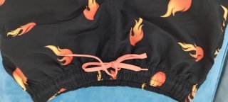 Costume uomo fiamme nere e arancioni