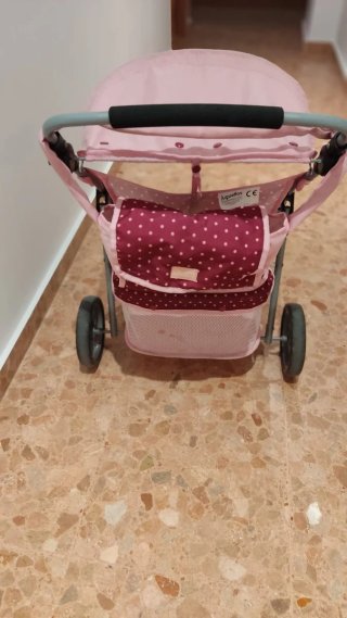 Carrito gemelar de muñecas rosa con lunares