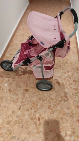 Carrito gemelar de muñecas rosa con lunares
