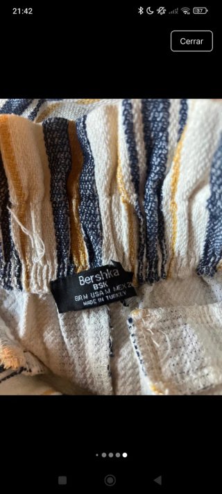 Pantalón corto a rayas con flecos