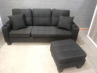 Sofá modular negro con puff convertible