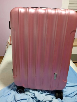 Maleta rosa de viaje