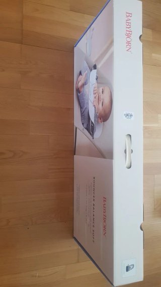 Hamaca BabyBjörn gris + juguete