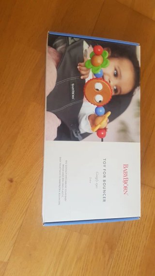 Hamaca BabyBjörn gris + juguete
