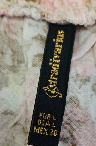 Falda floral Stradivarius con bolsillos laterales
