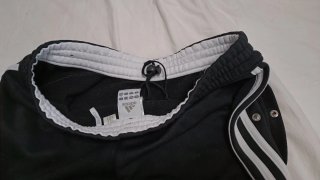 Pantalones Adidas negros con rayas blancas