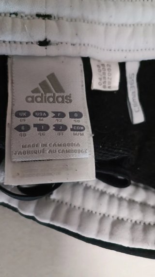 Pantalones Adidas negros con rayas blancas