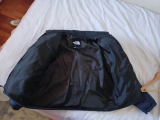 The North Face plumífero azul y negro