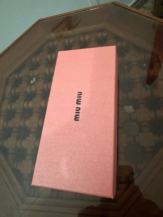 Gafas de sol Miu Miu negras y marrones