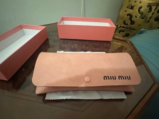 Gafas de sol Miu Miu negras y marrones