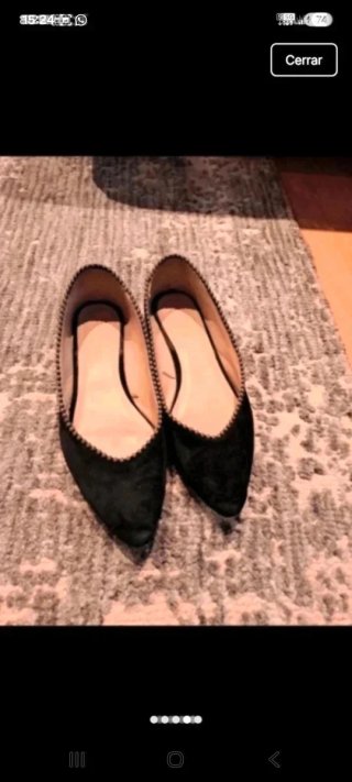 Zapatos planos negros con detalle