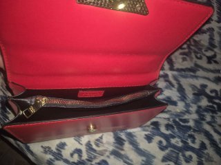 Borsa Prada rossa con tracolla a catena