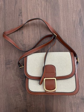 Bolso bandolera de lona y piel