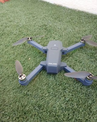 Drone con mando y accesorios