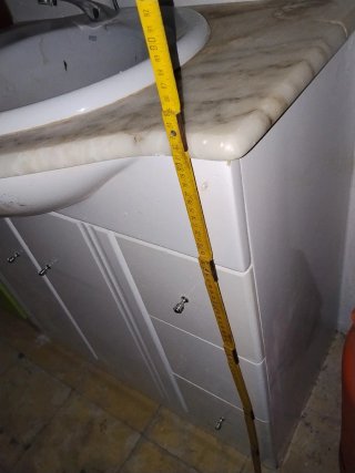 Mueble de baño con lavabo y mármol