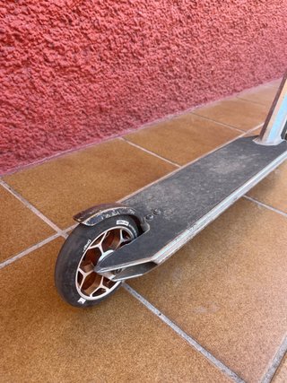 Monopatín freestyle plateado