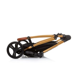 Carrito gemelar negro y dorado
