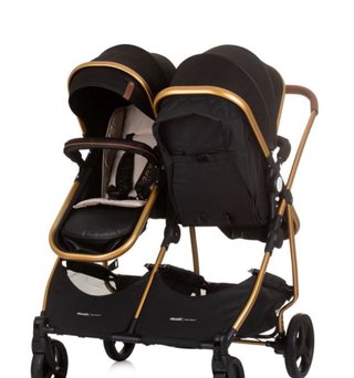 Carrito gemelar negro y dorado