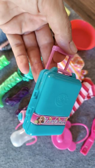 Set accessori Barbie: bici, vestiti, biberon