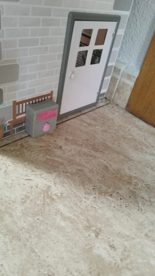 Casa de muñecas de madera