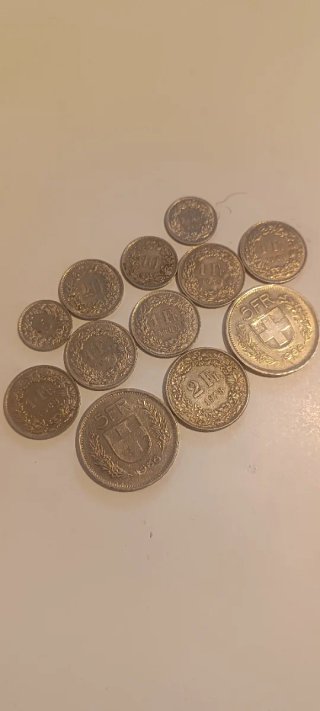 12 Monedas Franco Suizo