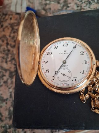 Reloj de bolsillo dorado con cadena.Chapado Oro
