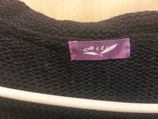 Chaqueta de punto negra sin mangas