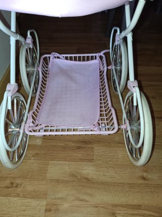 Carrito de muñecas rosa con capota