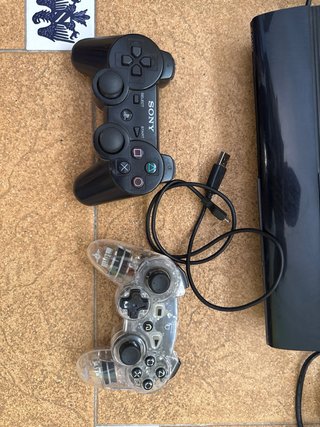 PS3 Super Slim + 2 Mandos + Volante + 7 Juegos