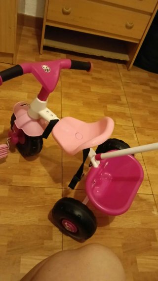 Triciclo infantil rosa con empujador