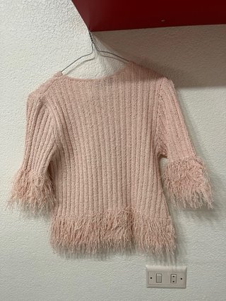 Chaqueta rosa con botones y flecos
