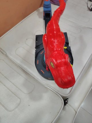 Juguete Dinosaurio Rojo con Pista
