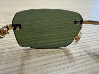 Gafas de sol Cartier doradas y verdes