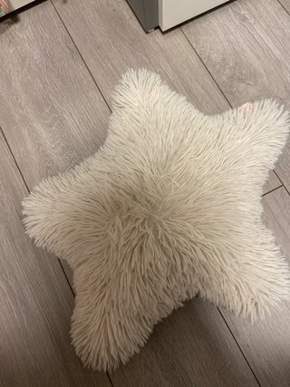 Cojín estrella beige suave