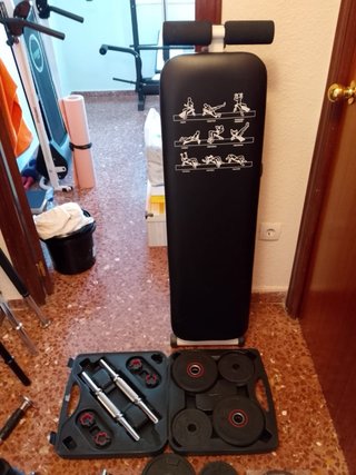 Banco de pesas y barra con discos