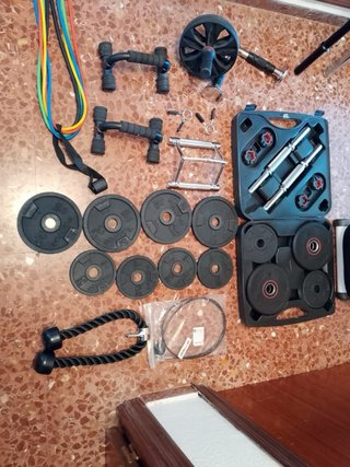Banco de pesas y barra con discos
