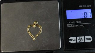 Colgante de oro de 18K. Peso: 1.87 gr