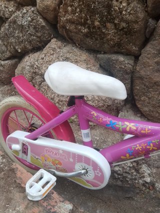 Bicicleta niña rosa con flores