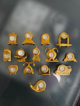 Lote 14 relojes colección miniatura dorados