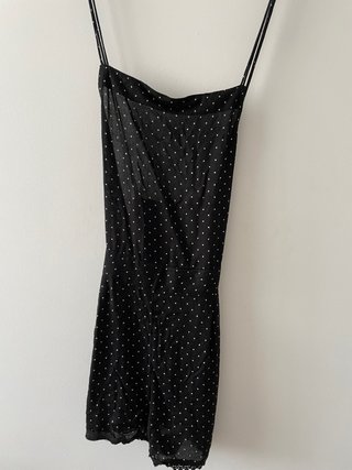 Mono negro con lunares blancos