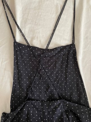 Mono negro con lunares blancos