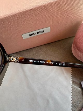 Occhiali Miu Miu Marroni