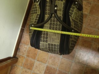 Bolso de viaje tipo maleta con tirador